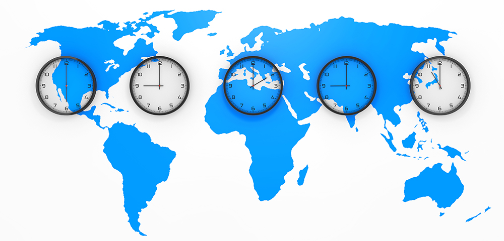 A map of the continents overlaid with five clocks showing different time zones.