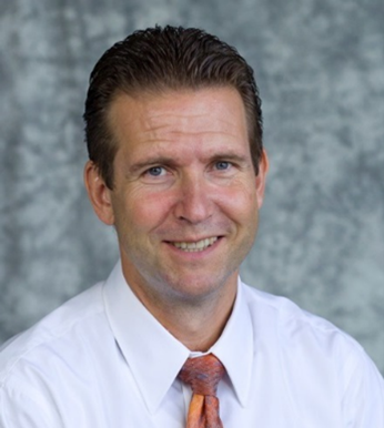 A professional headshot of Dr. Alexei Demchenko.