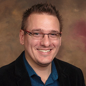A headshot of Dr. Tomas Helikar.