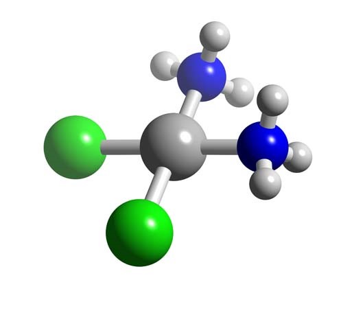 Space fill model of taxol showing chemicals structures primarily in green with white and red balls.